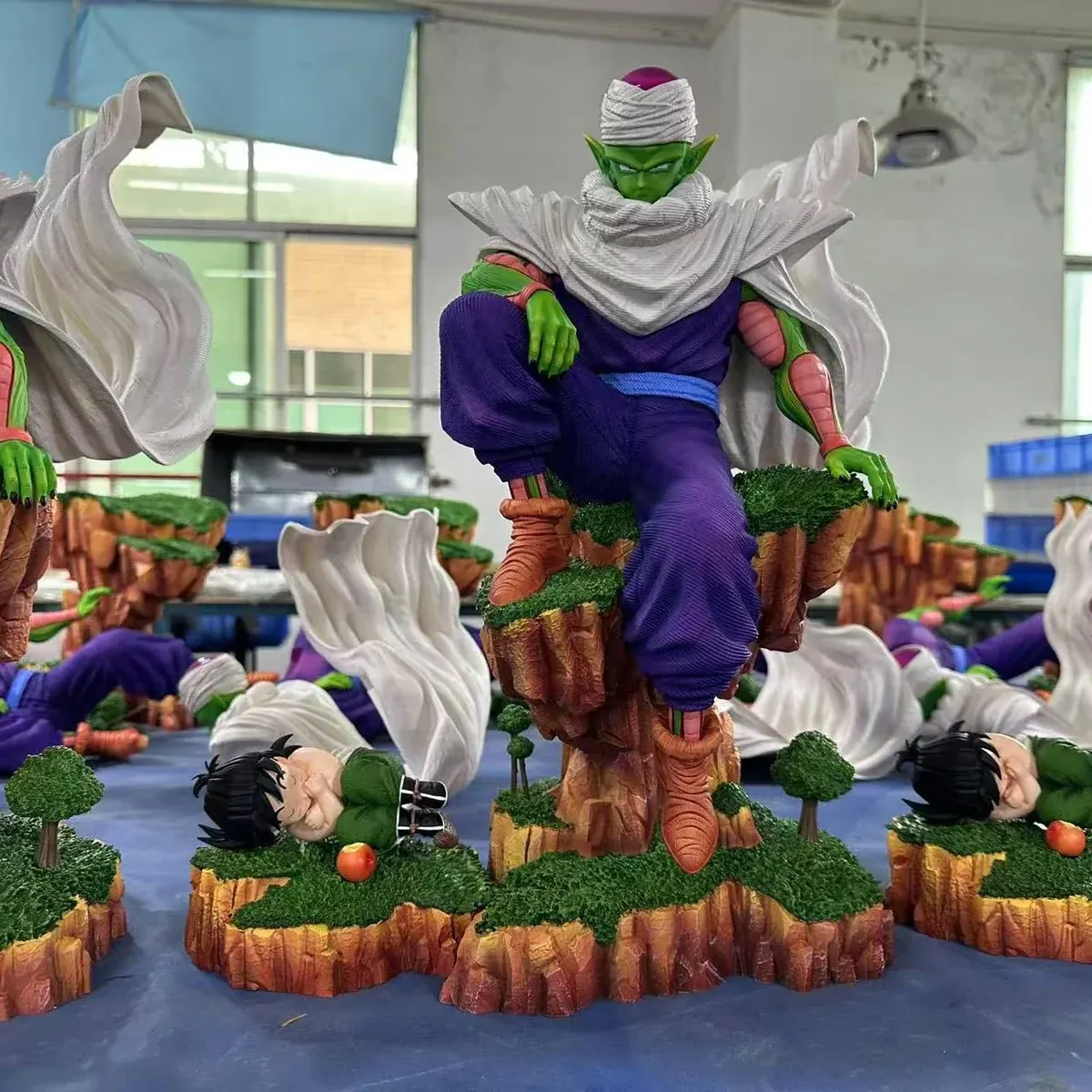 "Premium Piccolo Dragon Ball statue showcasing his iconic meditation training scene. Dynamic pose in a barren, rocky landscape."