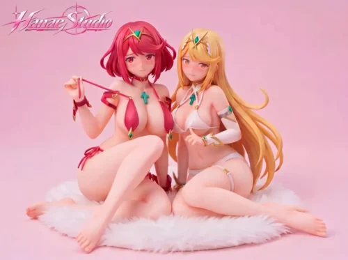 Pyra and Mythra 1/6 figure twin set with gem-accented swimsuits and soft blush sculpts, seated on the bonus rug from Hanae Studio.