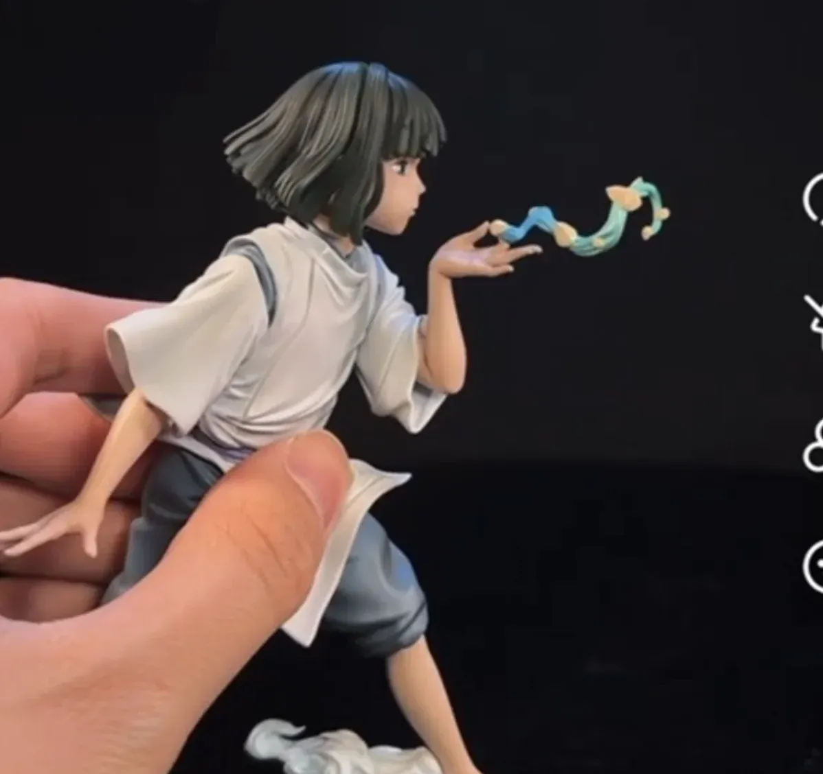"Huiyi Studio's ultra-limited Spirited Away Haku Dragon. Detailed views reveal its serene form, mystical blowing scales, and elegant dark wood base."